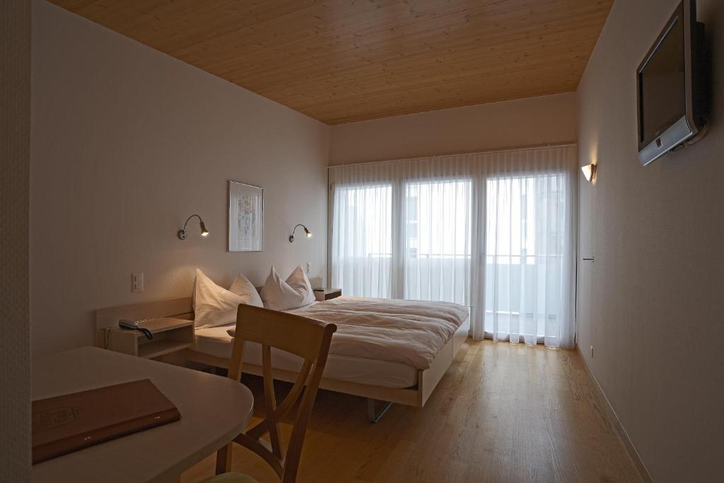 Weisses Rössli Swiss Quality Hotel客房内的一张或多张床位