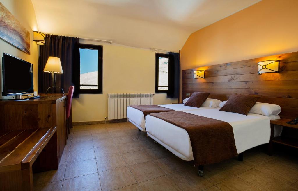 Hotel Màgic Pas客房内的一张或多张床位