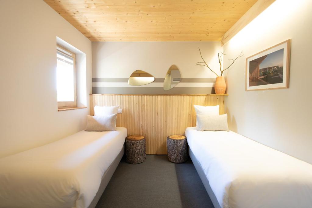 thecamp Hôtel & Lodges - Aix en Provence客房内的一张或多张床位