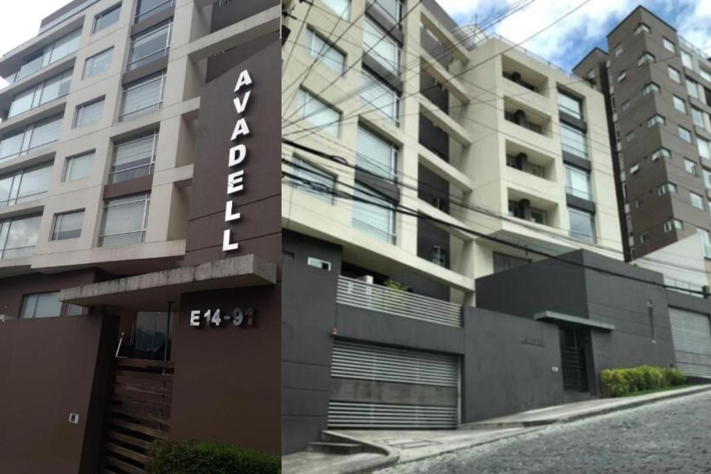 基多1430 Luxury Suite Edificio Avadell- Bellavista-Quito的带有读取阿克伦符号的建筑物