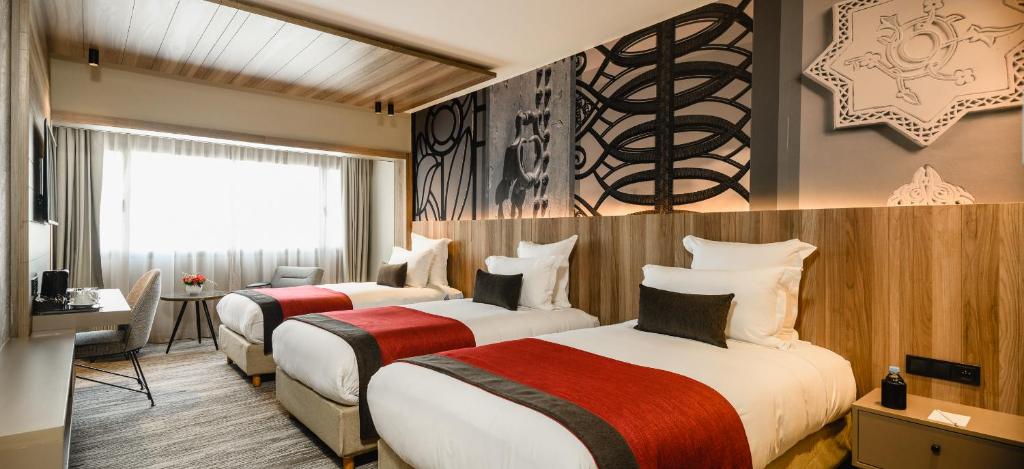 伊杜安法Spa酒店客房内的一张或多张床位