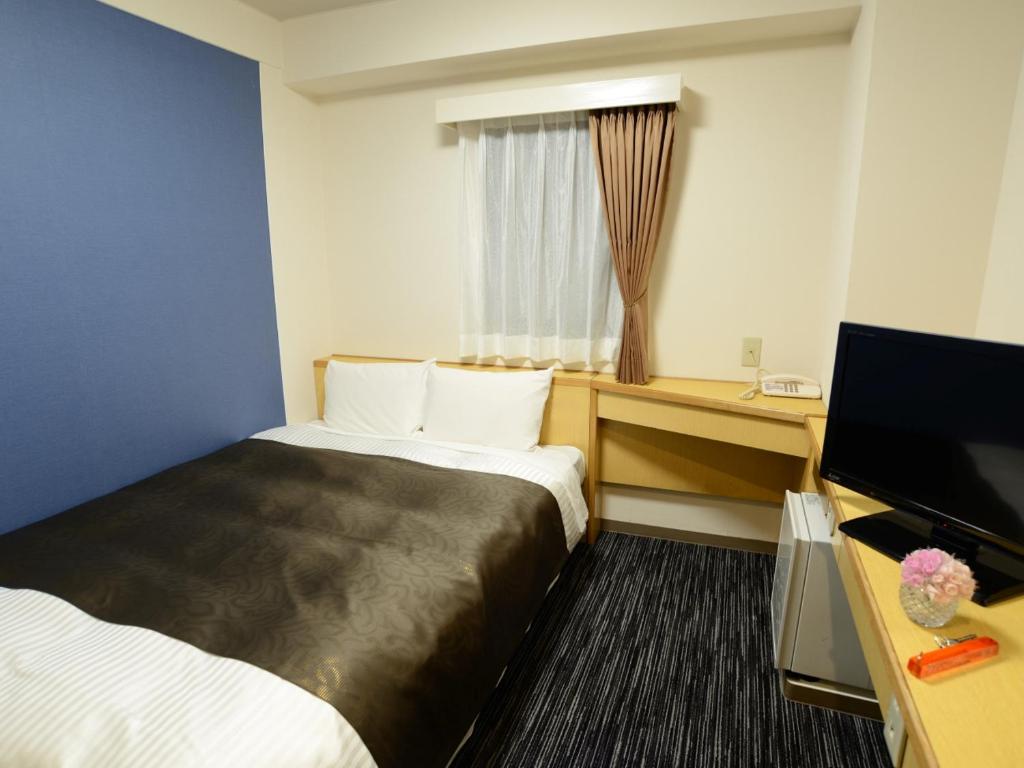 Nagoya Sakae Green Hotel客房内的一张或多张床位