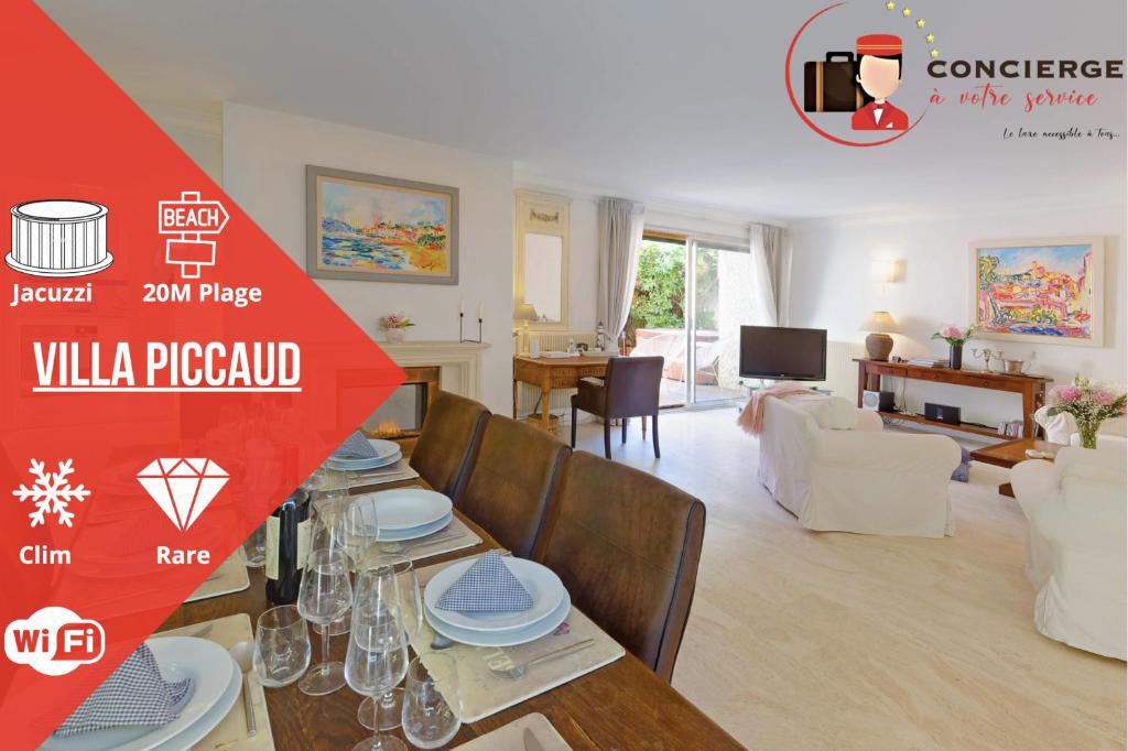 戛纳Villa Picaud - 50M plage, terrasse, clim - Unique Centre Cannes的一间带餐桌的客厅和一间客厅。