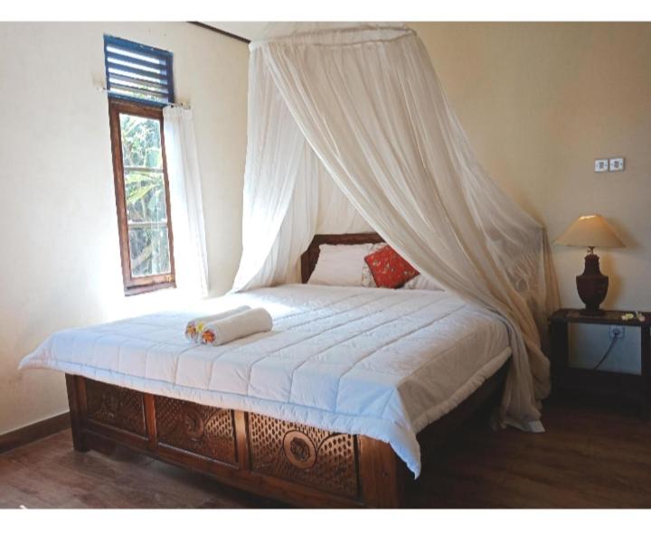 Taman Mesari Homestay客房内的一张或多张床位