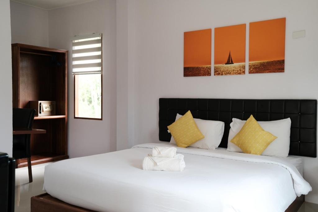 The Lodge at Koh Kood客房内的一张或多张床位