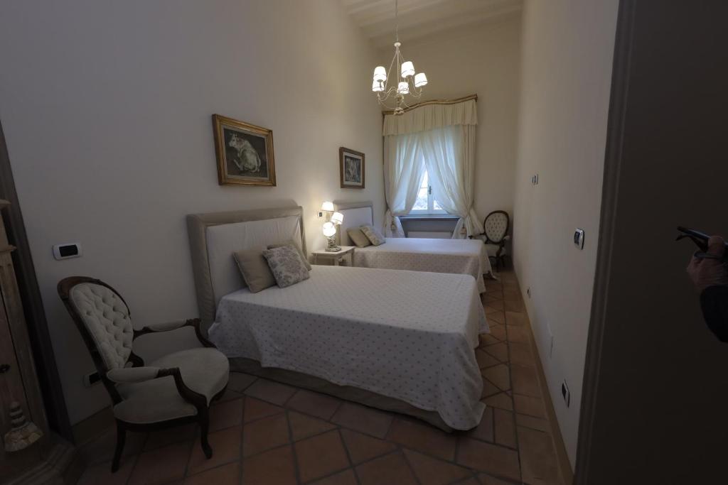 Casa Raiola Ercolano Luxury Rooms &amp; Spa客房内的一张或多张床位