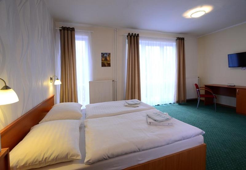 Hotel KRYŠTOF客房内的一张或多张床位