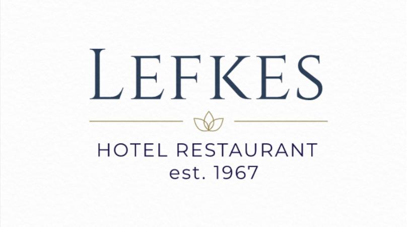 帕拉西亚斯Hotel Lefkes的阅读酒店餐厅座位的标志