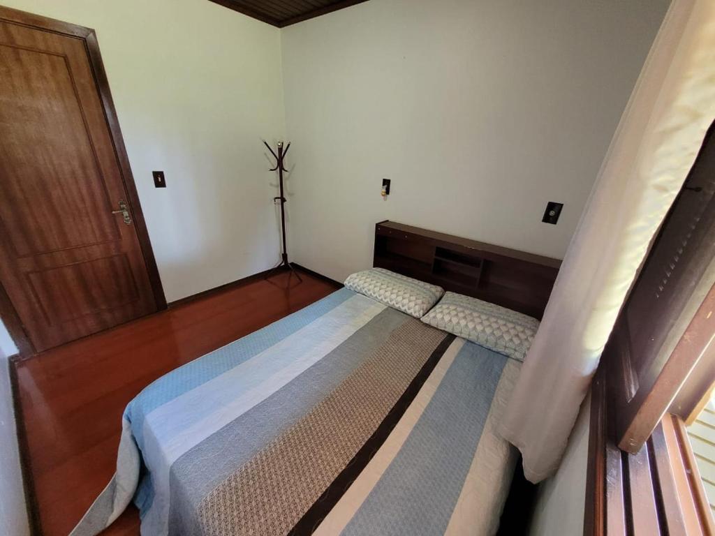 Espaço Doméstico客房内的一张或多张床位