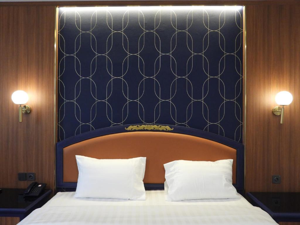 Maxwell Hotel Jakarta客房内的一张或多张床位
