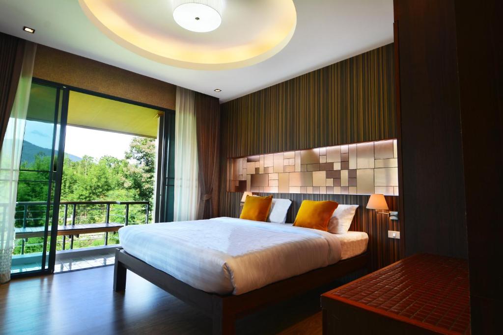 泊拉帕精品酒店客房内的一张或多张床位