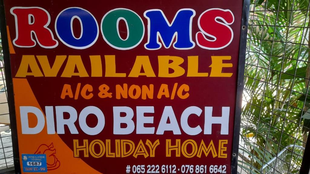 拜蒂克洛DERO BEACH HOLIDAY HOME的海滩度假公寓的玫瑰花标志