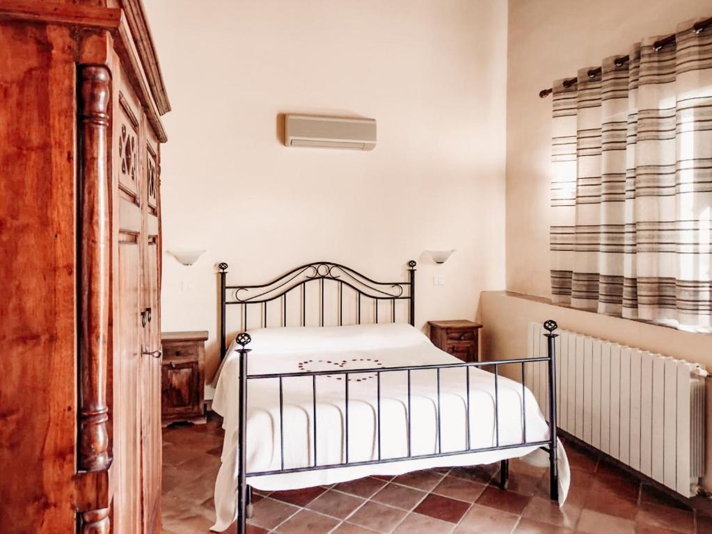 Terme Acqua Pia客房内的一张或多张床位