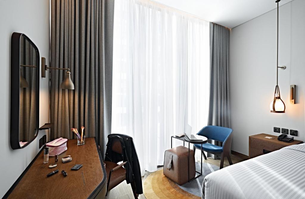 Revier Hotel - Dubai客房内的一张或多张床位