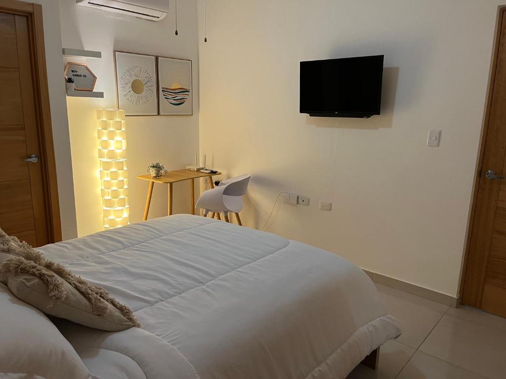 Ambar 5D - Céntrico apart estilo Boho Chic客房内的一张或多张床位