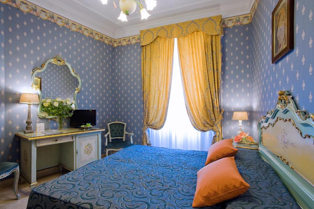 玛利亚圣劳伦佐别墅酒店客房内的一张或多张床位