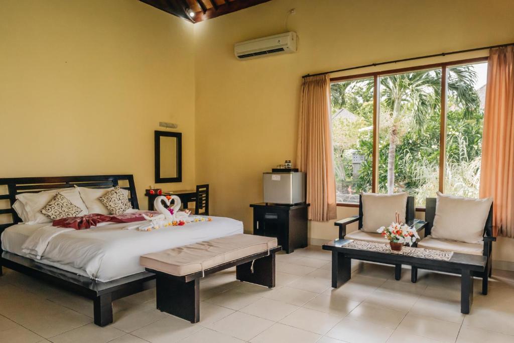 Ocean View Tulamben Dive &amp; Resort客房内的一张或多张床位