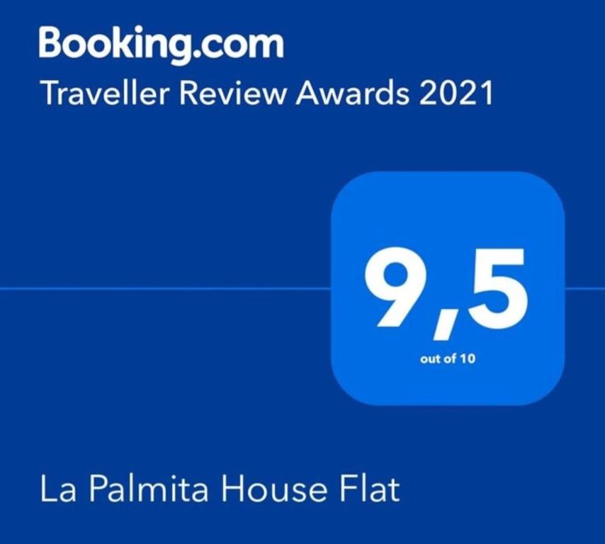 阿格特La Palmita House Flat的带有旅行拖车接收程序的手机的截图