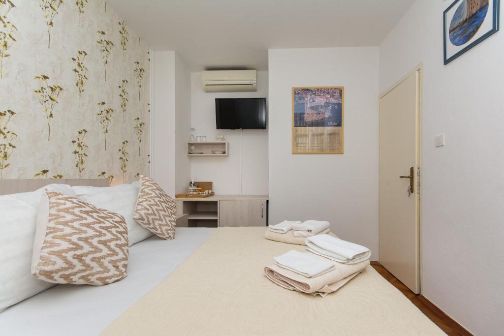 格洛丽亚别墅酒店客房内的一张或多张床位