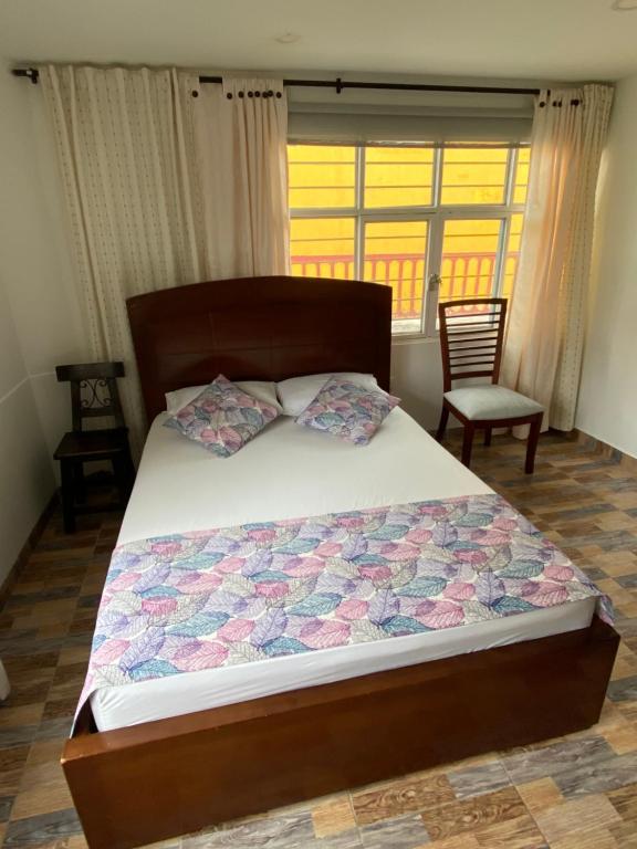 Hotel Encanto Filandia客房内的一张或多张床位