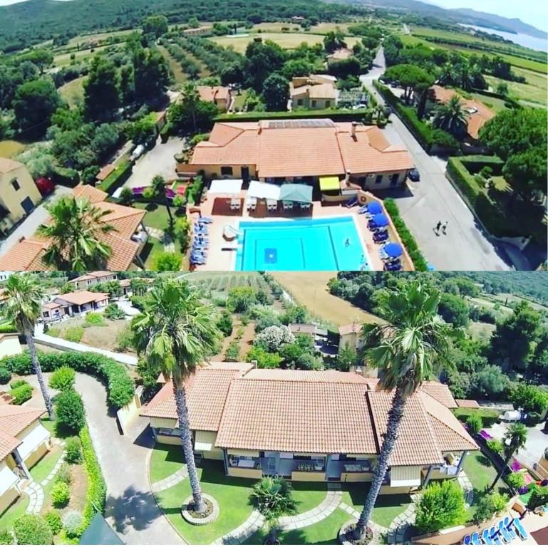 费拉约港阿里泰公寓的享有度假村的空中景致,设有游泳池和棕榈树