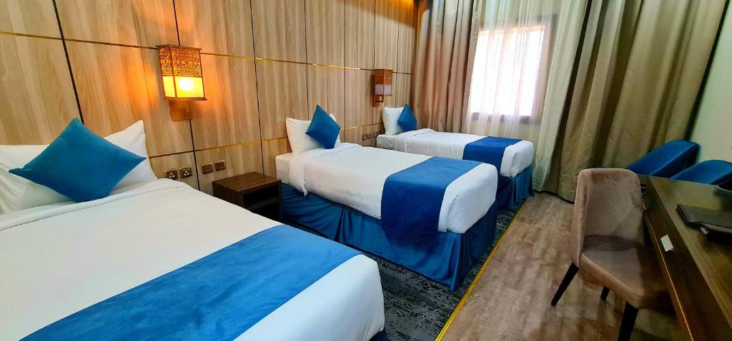 Al Ebaa Hotel客房内的一张或多张床位