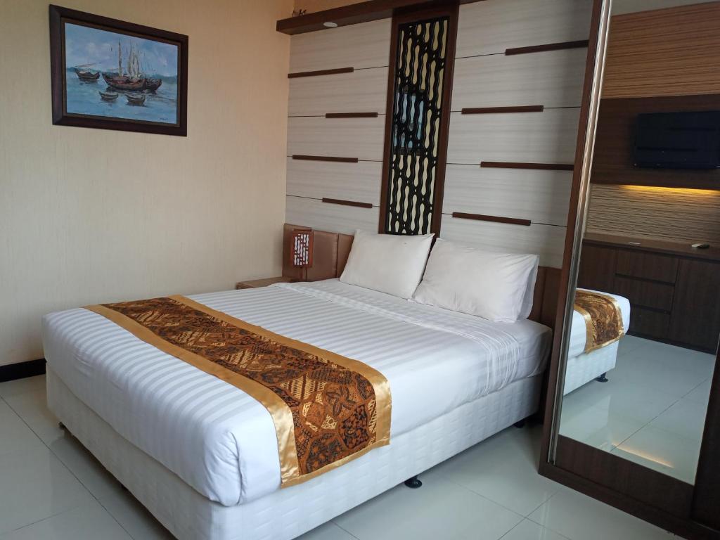 Dmadinah Residence Solo客房内的一张或多张床位