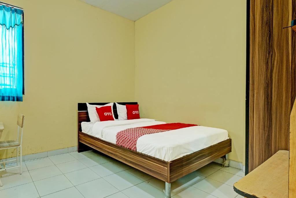 OYO 91532 Malioboro Guesthouse客房内的一张或多张床位
