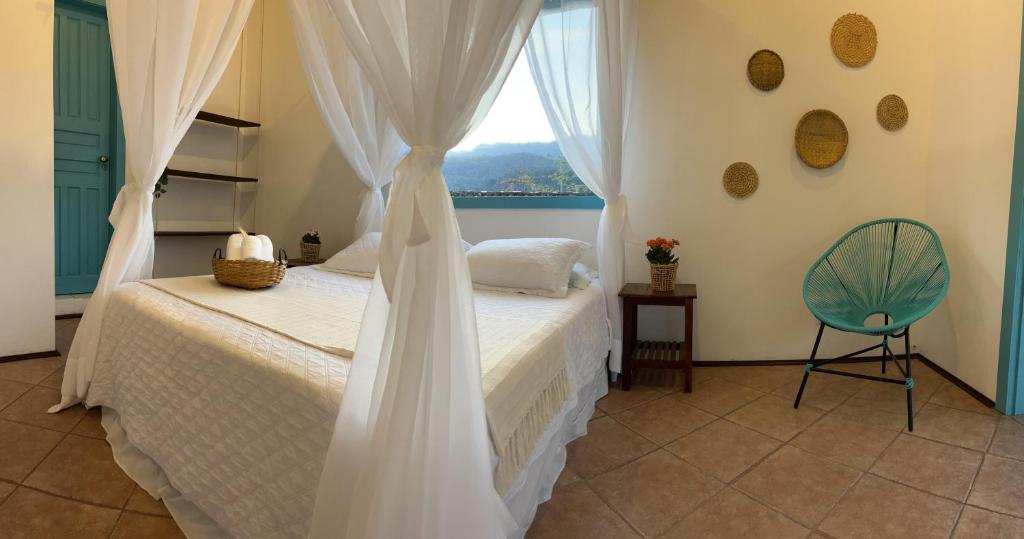 Villa Tiê Paraty客房内的一张或多张床位