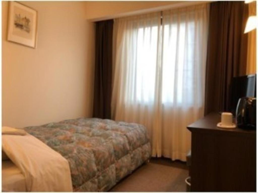Grand Plaza Nakatsu Hotel - Vacation STAY 28267v客房内的一张或多张床位