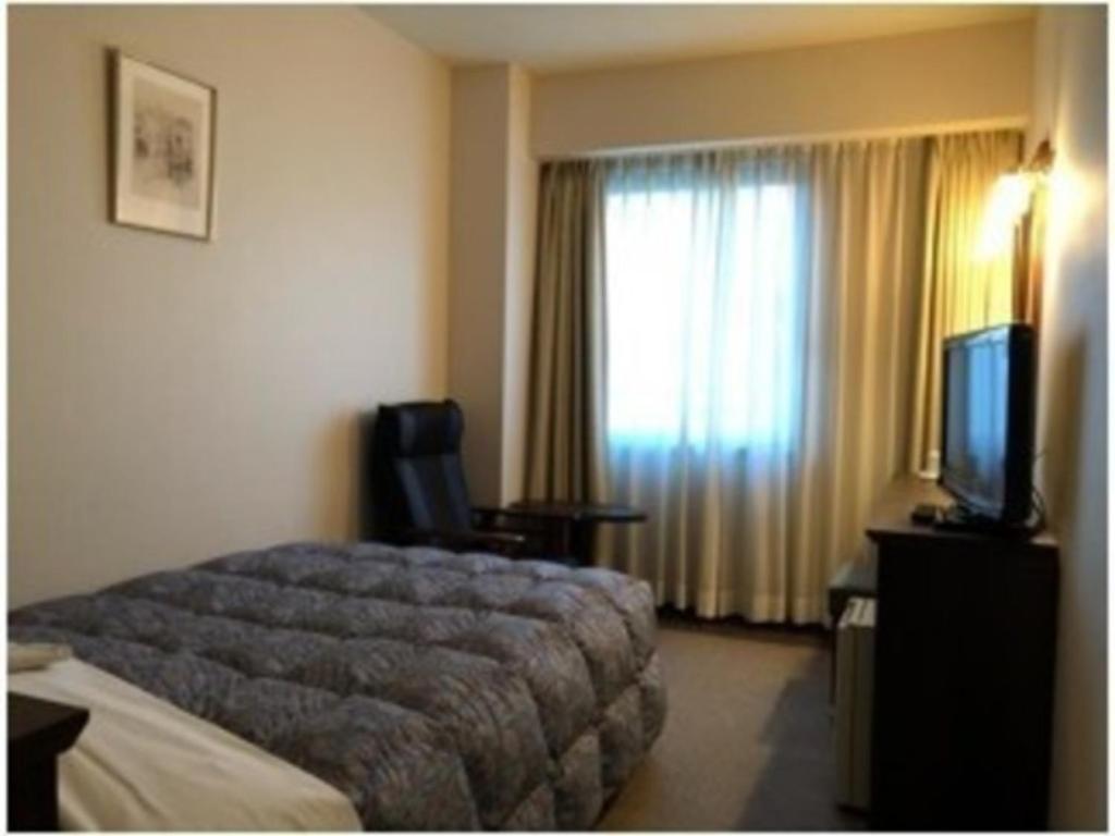 Grand Plaza Nakatsu Hotel - Vacation STAY 28290v客房内的一张或多张床位
