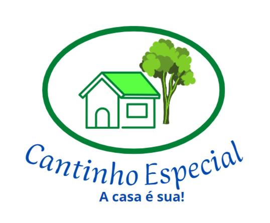 累西腓Cantinho especial的房屋和树的标志