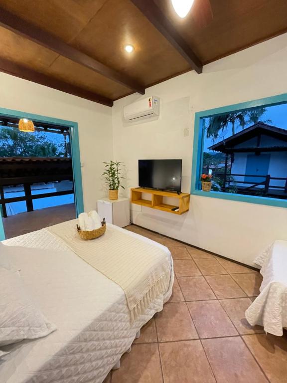 Villa Tiê Paraty客房内的一张或多张床位
