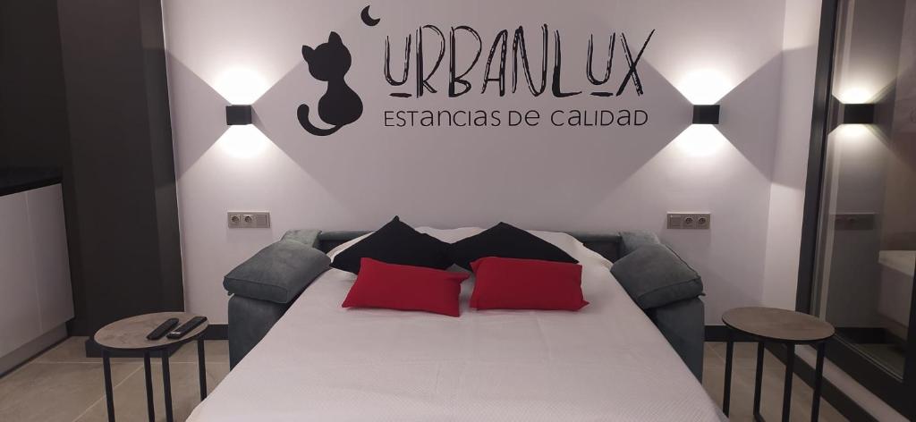 Urbanlux Olimpia Familiar客房内的一张或多张床位