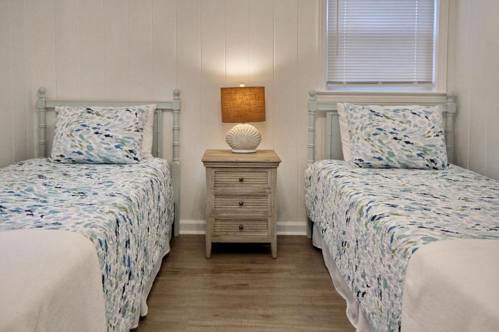 Lovely Beach Bungalow客房内的一张或多张床位