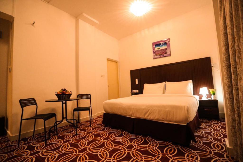 AL KARNAK HOTEL - BRANCH客房内的一张或多张床位