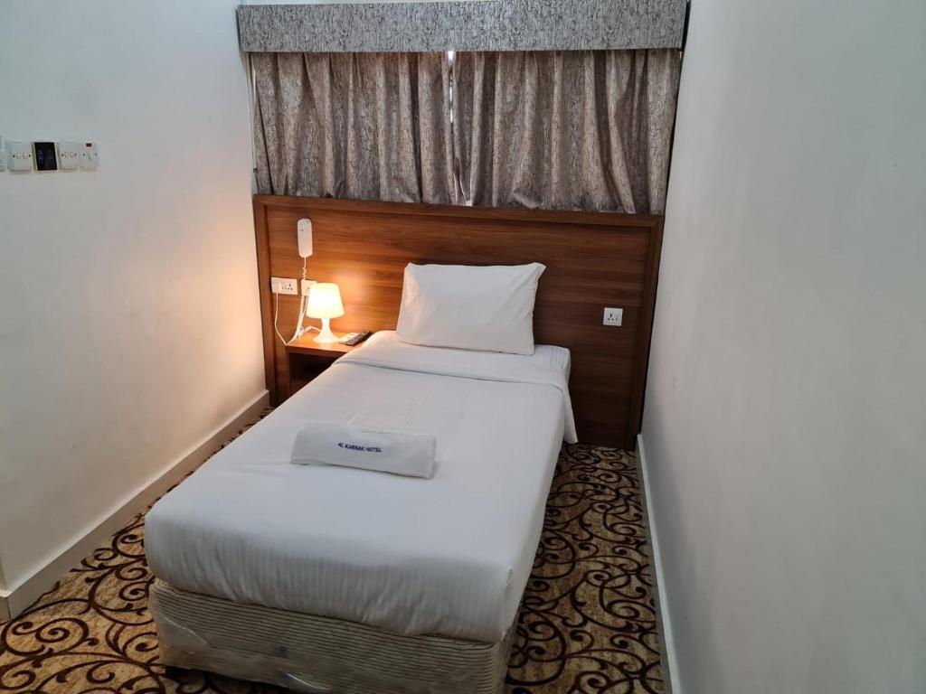 AL KARNAK HOTEL - BRANCH客房内的一张或多张床位