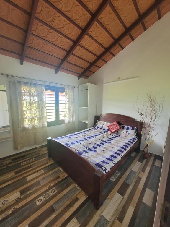 奇克马格尔Aashirvada的卧室配有一张床