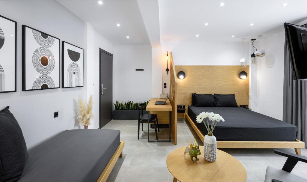 塞萨洛尼基Pillow urban stay的一间卧室设有一张床和一间客厅。