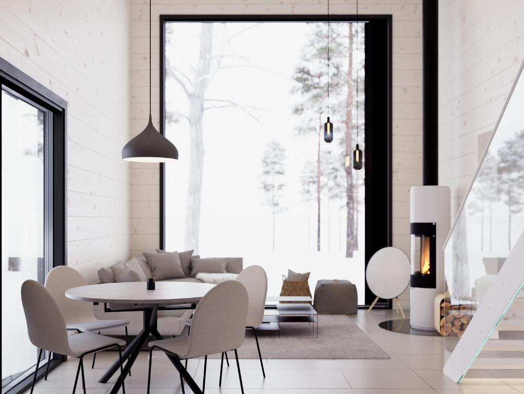 穆奥尼奥Polaris Villas的白色的客厅配有桌椅