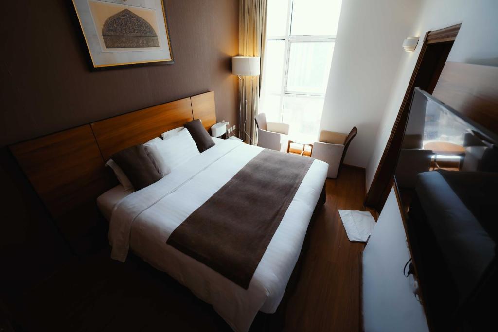 Nour Al Thuria Hotel客房内的一张或多张床位