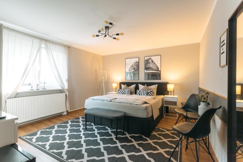 德绍Das Schlafgut Dessau的卧室配有床和黑白地毯。