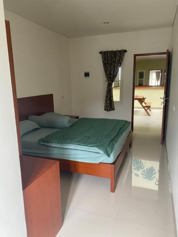 Rumah Pondok Pinang客房内的一张或多张床位