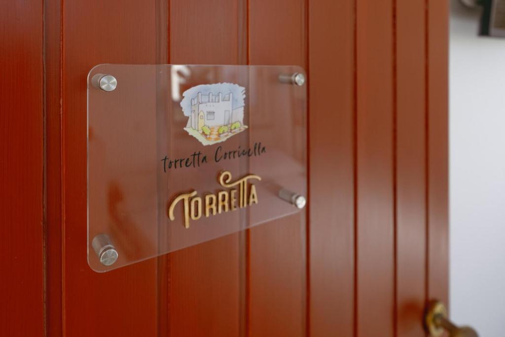 普罗奇达TORRETTA CORRICELLA- Torretta的门上标有toraja canada字样的标志