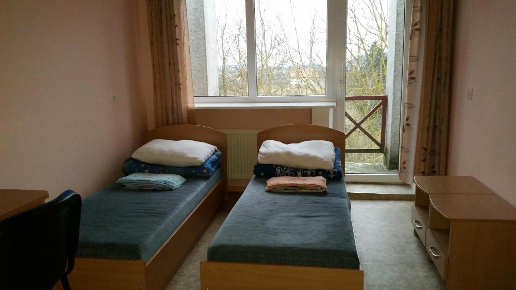 Poilsio namai Šaltinelis客房内的一张或多张床位