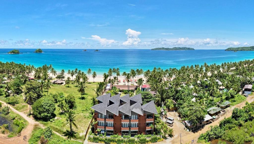 爱妮岛Nacpan Beach Resort的享有度假胜地的空中景致,以海洋为背景