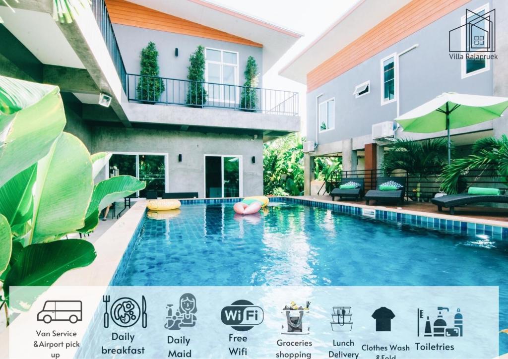 清迈Villa Rajapruek Entire 3 villa with pool near Airport and city center的大楼前的游泳池