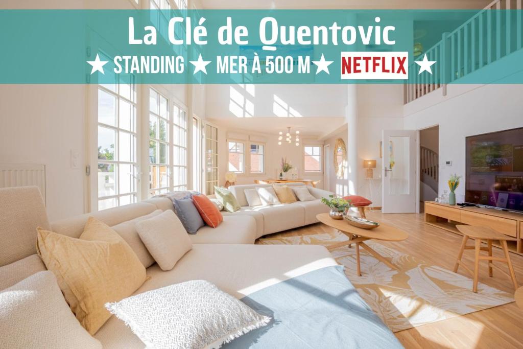 勒图凯-巴黎普拉日La Clé de Quentovic ◎ Duplex de 150 m2 ◎ Standing的客厅配有沙发和桌子