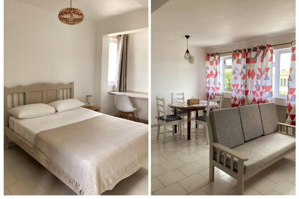 CurepipeLa Péninsule - Town Apartment No. 3的一张床位的卧室和一间餐厅的两张照片