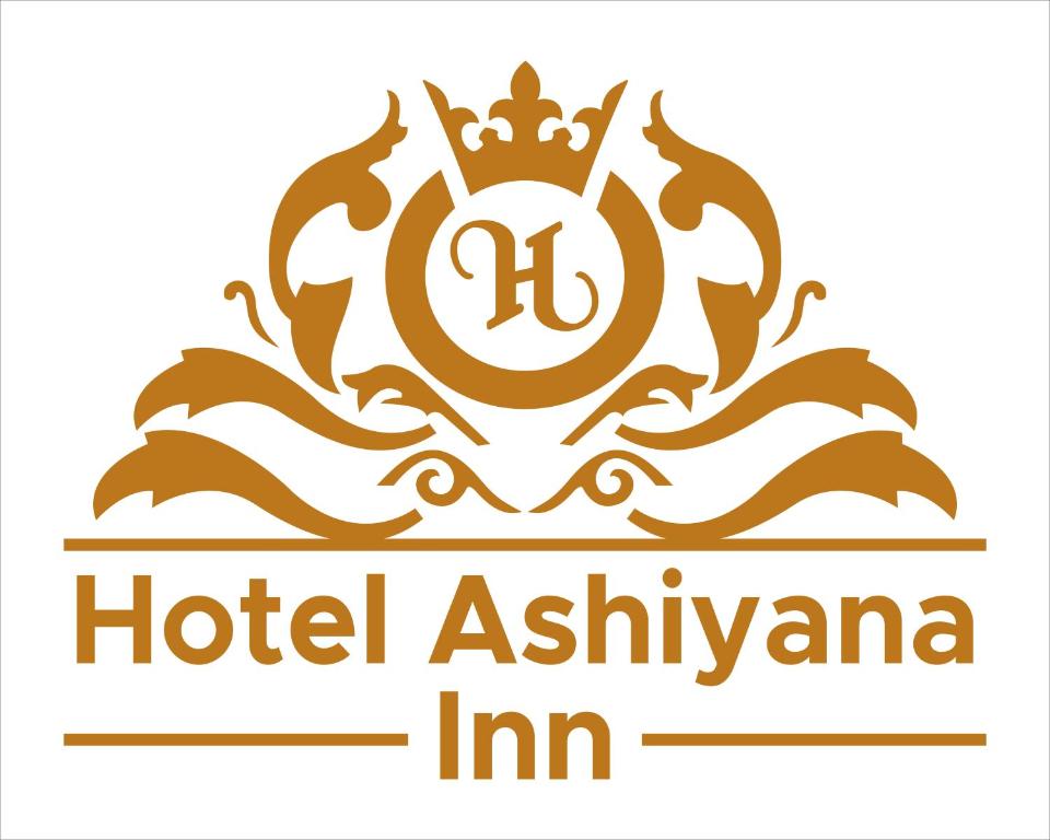 巴特那The Ashiyana Inn Hotel的酒店灰套屋标志